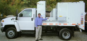 Judge-Executive in front of new garabge truck